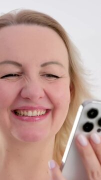 Woman, comic and phone social media in office scrolling while laughing at funny online meme Happy, humor and laughter of marketing girl on smartphone break reading fake news in workspace