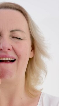 psychosomatics unwillingness to speak sore throat lump in throat unpleasant emotions negative facial expression raise eyes up tighten face open mouth slightly touch neck