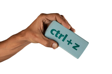black male Hand holding an eraser with inscription ctrl z on white background