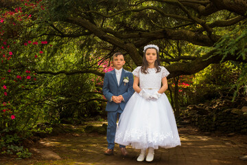 Portraits of the twins first holy communion