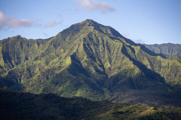 Fototapeta na wymiar Early Morning Light Shines on Tropical Mountains in Kauai Hawaii