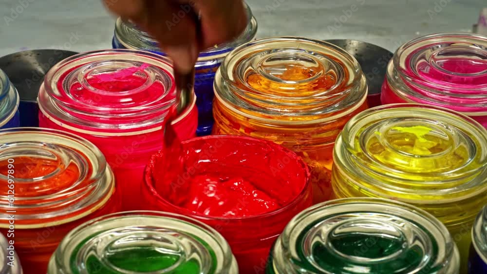 Aufkleber stirring red color.use a trowel to stir the mass in a clear glass bottle..the subtle hues swirled to
