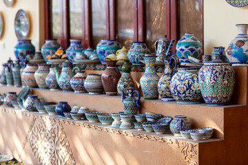 water jugs in gallery on wooden box
