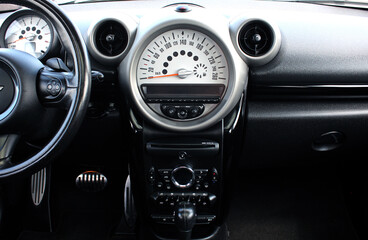 Vinnytsia, Ukraine; June 10, 2023. Mini Cooper S interior. Mini Cooper S driver seat. Mini Cooper dashboard. Mini Cooper speedometer.