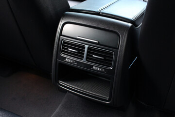 Obraz premium Rear passenger air vent of modern luxury car. Air vents in the rear seats in the passenger car.