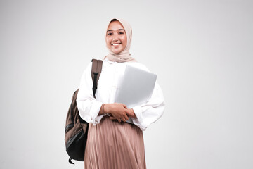 Young muslimah female student is carrying laptop. Prepare back to school isolated white background