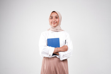 Muslimah college carrying book and pen for studying isolated white background
