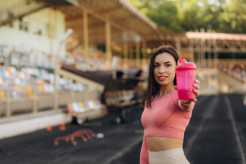 Asian young woman drinking water after jogging,healty and sport concept