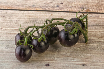 Ripe tasty black cherry tomato