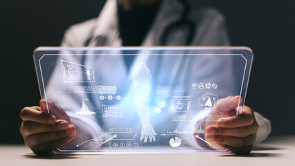 Close-up of a doctor using tablet pc with medical hologram