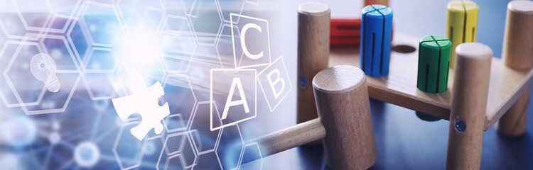 Children's development. Children's wooden toy on the table in the play area. Room of children's creativity and self-development. Wooden constructor.