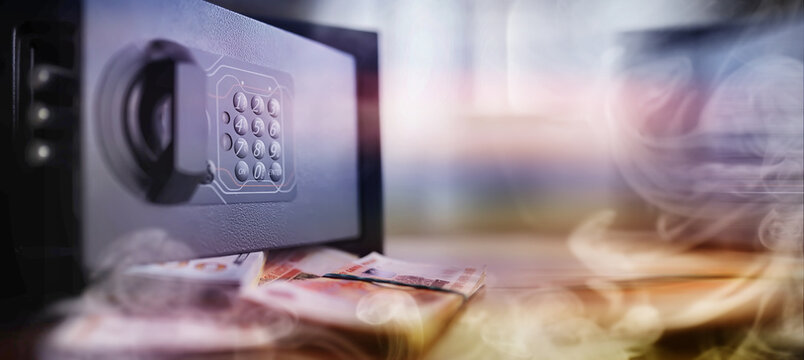 Deposit in cash. Russian rubles are in the safe. money in a residential safe close-up photo.