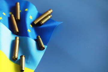 The concept of European Union support for Ukraine in a military conflict. Solidarity. Politics. Flags are on the table.