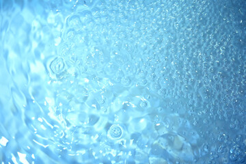 Blue water texture. Bubbles and bubbling water.