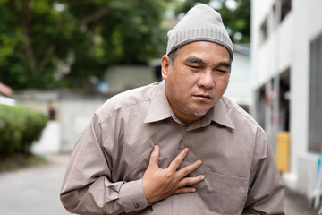 Terminally ill old man cancer patient wearing grey chemotherapy hat, feel the sickness pain relapse...