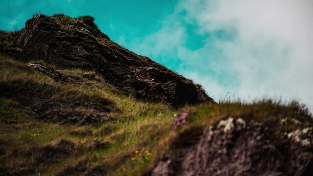 Time lapse of the clouds passing over a moorland cliff by the sea. Shot near Stornoway on the Isle of Lewis, part of the Outer Hebrides of Scotland.
