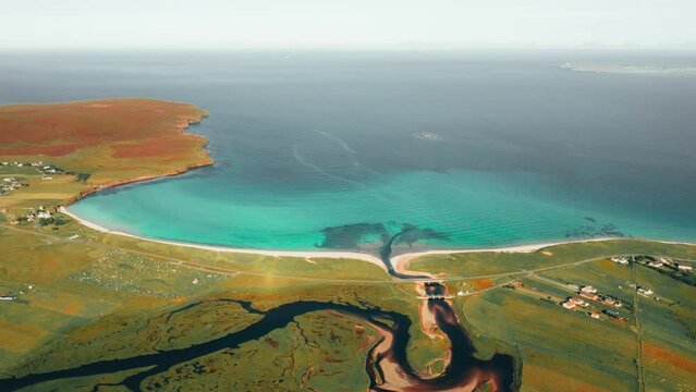 Drone time lapse over Gress beach and the nearby river, marshland and estuary. Filmed over the village of Back on the Isle of Lewis, part of the Outer Hebrides of Scotland.