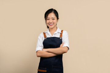 Start a small business. Happy young asian businesswoman wearing white shirt and apron.