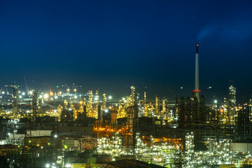 aerial view oil refinery Oil and gas industry, petrochemical plant area and energy concept, oil storage tanks at night time with lights.