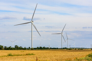 Wind turbines at the agricultural field. Clean energy. Ecological concept