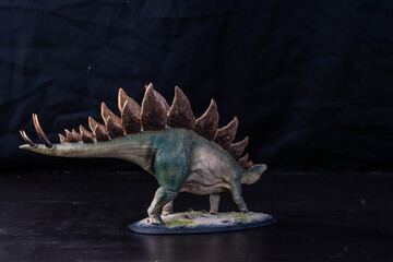 Dinosaur stegosaurus in the dark
