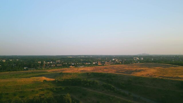 Aerial scenic view of slagheap landscape near old coal mine, drone footage.