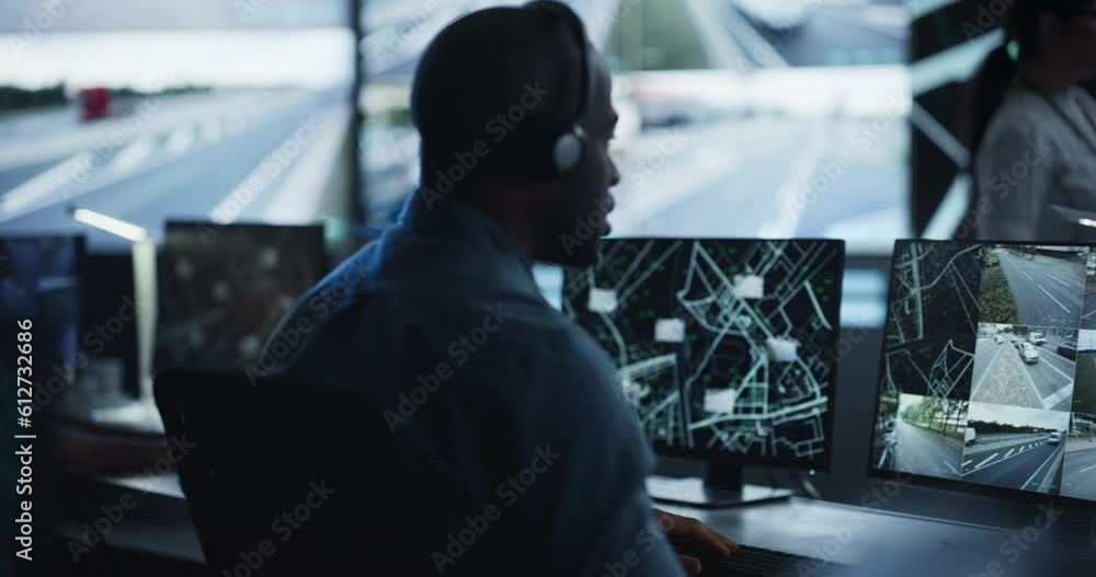 Poster Multicultural Surveillance Specialists Work in a Dimly Lit Monitoring Room. Officers Track Target from Satellite on Computers. High-Tech Environment with Cybersecurity and Military Operations