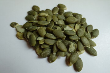 Macro of heap of hulled kernels of pumpkin seeds