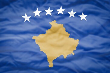 Kosovo flag on a wavy background. Wavy flag of Kosovo fills the frame.