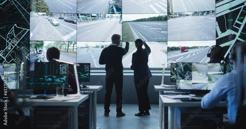 Aufkleber Two Diverse Male and Female Software Engineers Discuss Live Analysis Feed with City Road and Traffic Updates. Managers and Data Scientists Collaborate in a Modern Monitoring Office