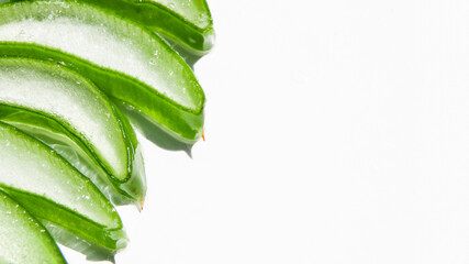 Slides, pieces of green fresh aloe vera. On a white background.