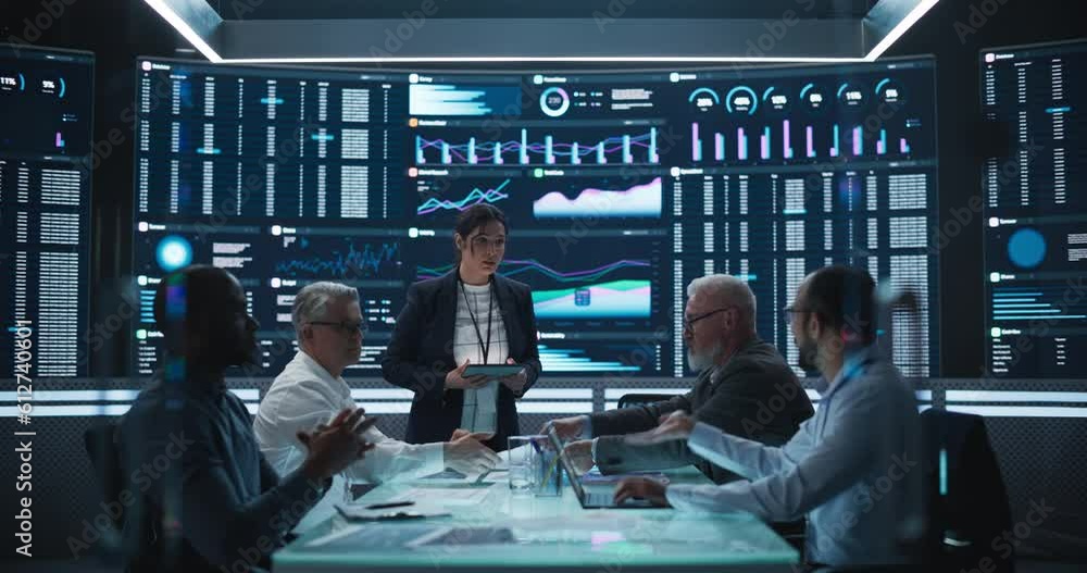 Aufkleber Diverse Team Of Data Scientists and Software Developers Discussing Reports in Monitoring Room with Analytics Feed on Big Digital Screen. Female Leading Artificial Intelligence Company Board Meeting