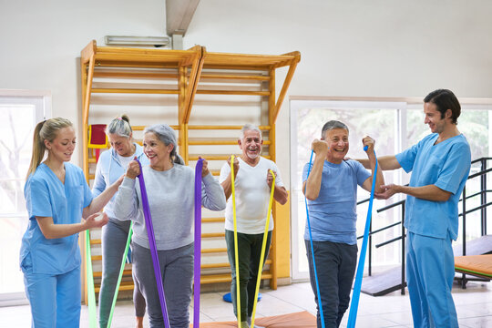 Happy senior people doing workout in fitness class