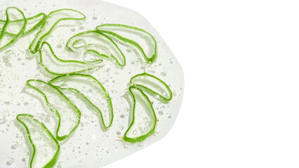 Thinly sliced slices or pieces of aloe vera in a transparent gel with bubbles. On a blank...