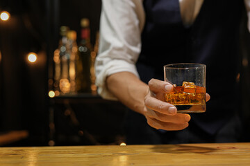 Bartender pouring Whiskey, on  bar,