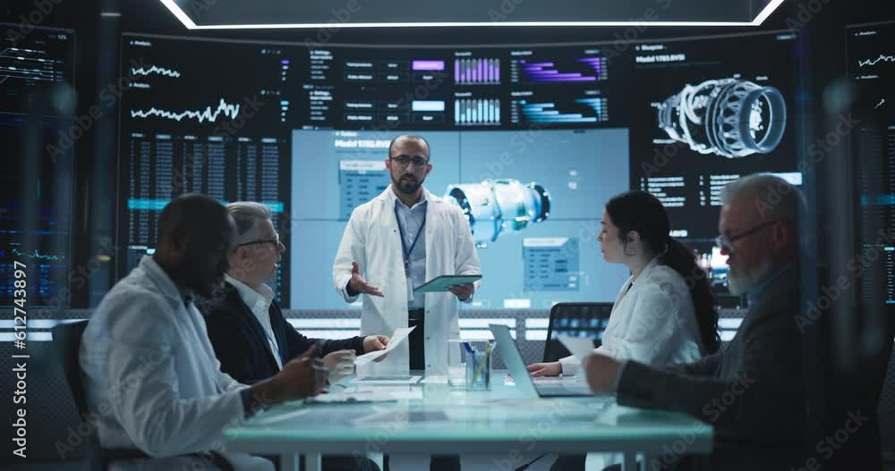 Fototapete Group of Industrial Engineers Having a Meeting in a Research and Development Science Laboratory. Diverse Group of Professionals Discussing New Turbine Jet Engine Design on Big Digital Screen