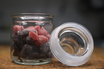 Candies in an opened glass jar