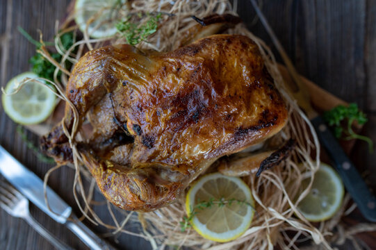 Rotisserie Chicken On Wooden Table