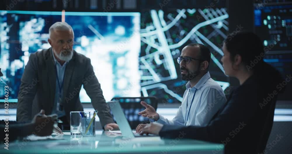 Leinwandbilder team of surveillance experts having a discussion during a meeting in an advanced research center. di