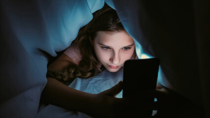 Screen time. Child insomnia. Late night chat. Internet addiction. Sleepless girl texting...