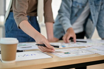 An app developer team is in the meeting, checking a new app prototype together.