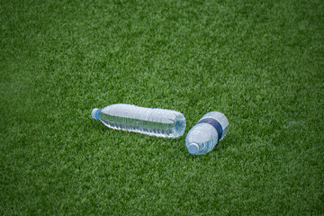 water bottles on artificial grass