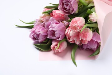Beautiful bouquet of colorful tulip flowers on white background