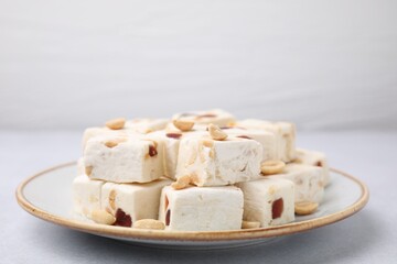 Pieces of delicious nutty nougat on light table