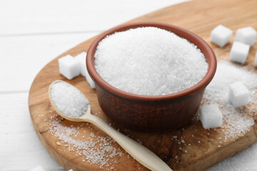 Fototapeta na wymiar Different types of sugar on white wooden table, closeup