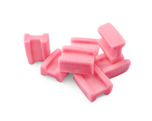 Many tasty pink chewing gums on white background