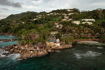 Fototapeta na wymiar Tropical aerial landscape, luxury villas with amazing sea and lagoon beach, tropical nature
