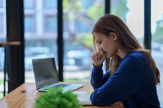 Burnout, Worried,serious Latin Girl College Student Watching Distance Online Learning Class, University Webinar Or Having Talk On Laptop Video Call And Use Notebook To Virtual Meeting At Living Room.