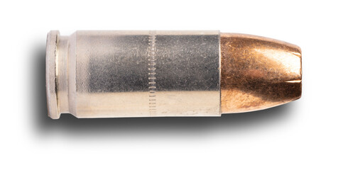 Dropshadow below a shiny 9 mm self-defense cartridge