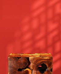 Brown natural log wood cube podium table in sunlight, Chinese round window grill shadow on blank...